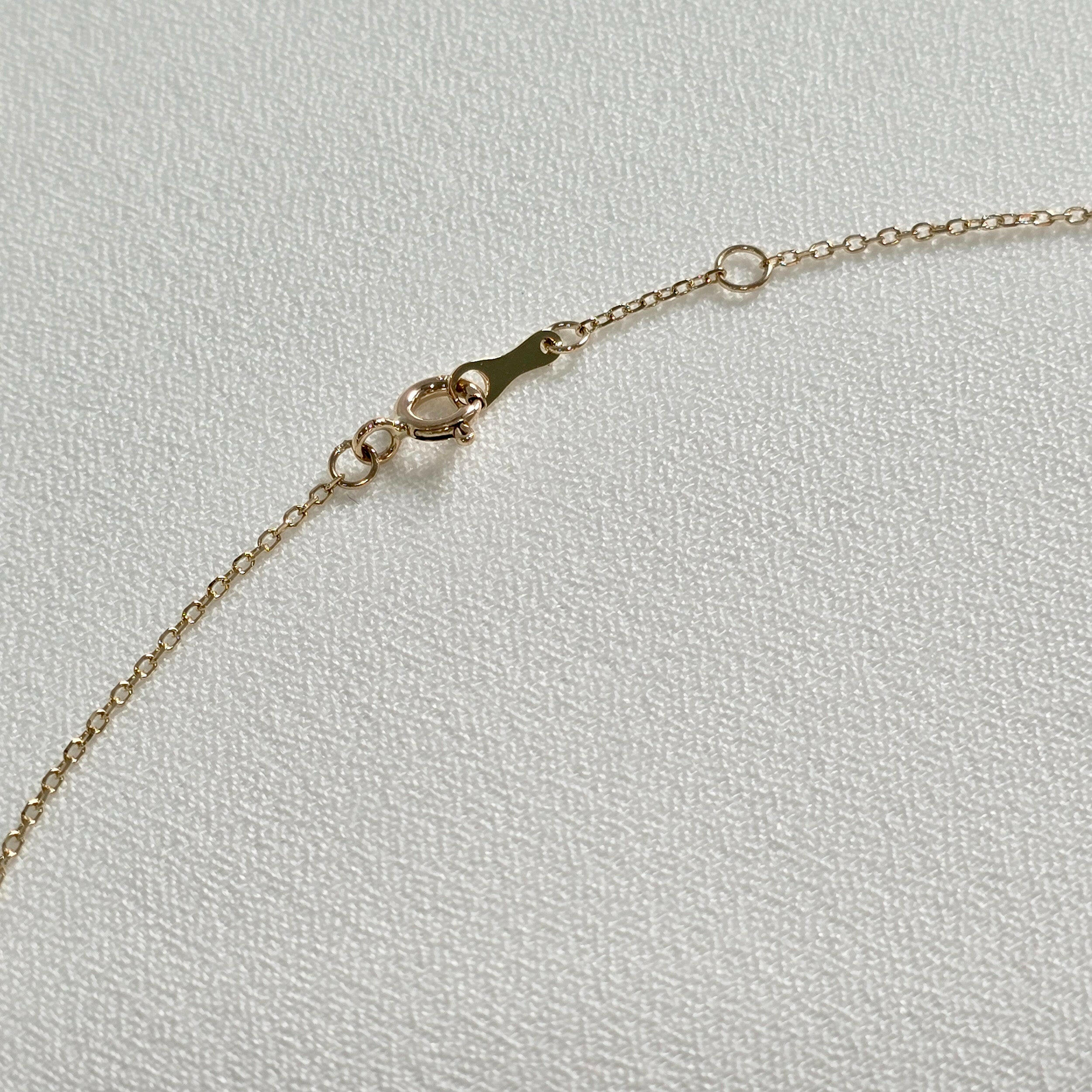 Back clasp and extender chain in polished 14K yellow gold