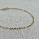Close-up of 14K gold chain construction and fine link design