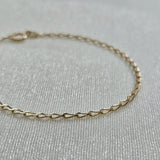 Close-up of 14K gold chain construction and fine link design