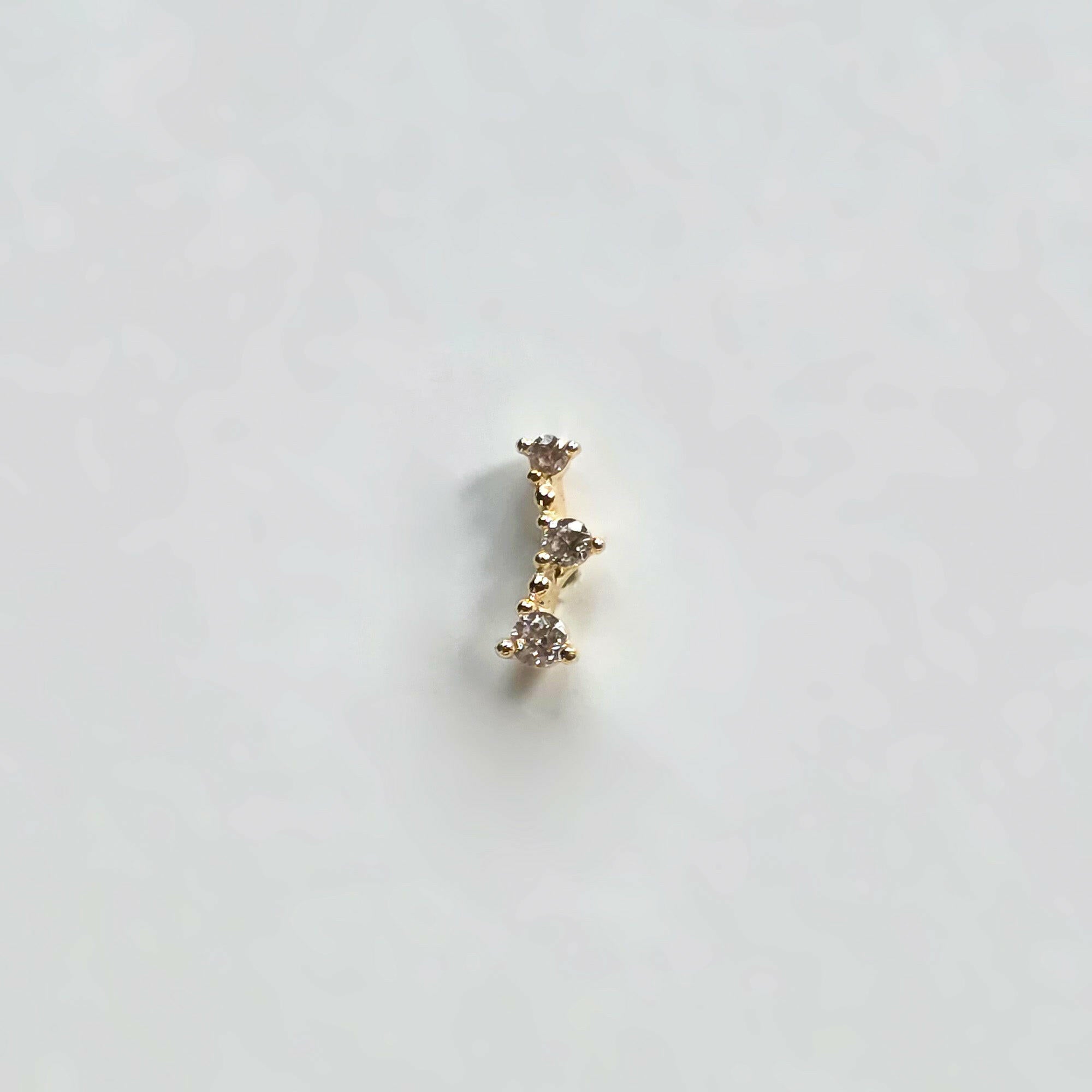 Front-facing shot of the Ella Cartilage Earring showing crystal curvature
