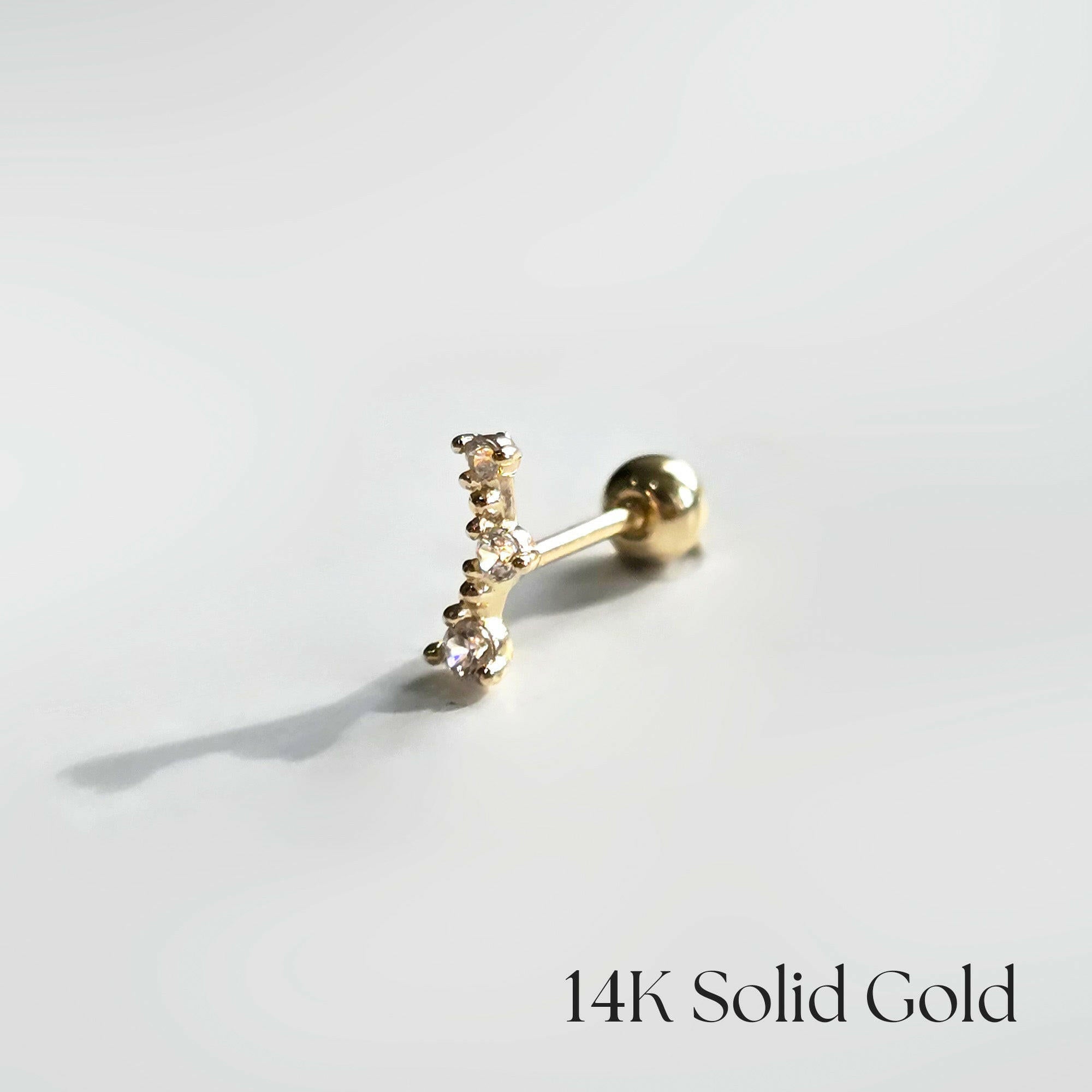 Side profile of the Ella earring on a neutral background