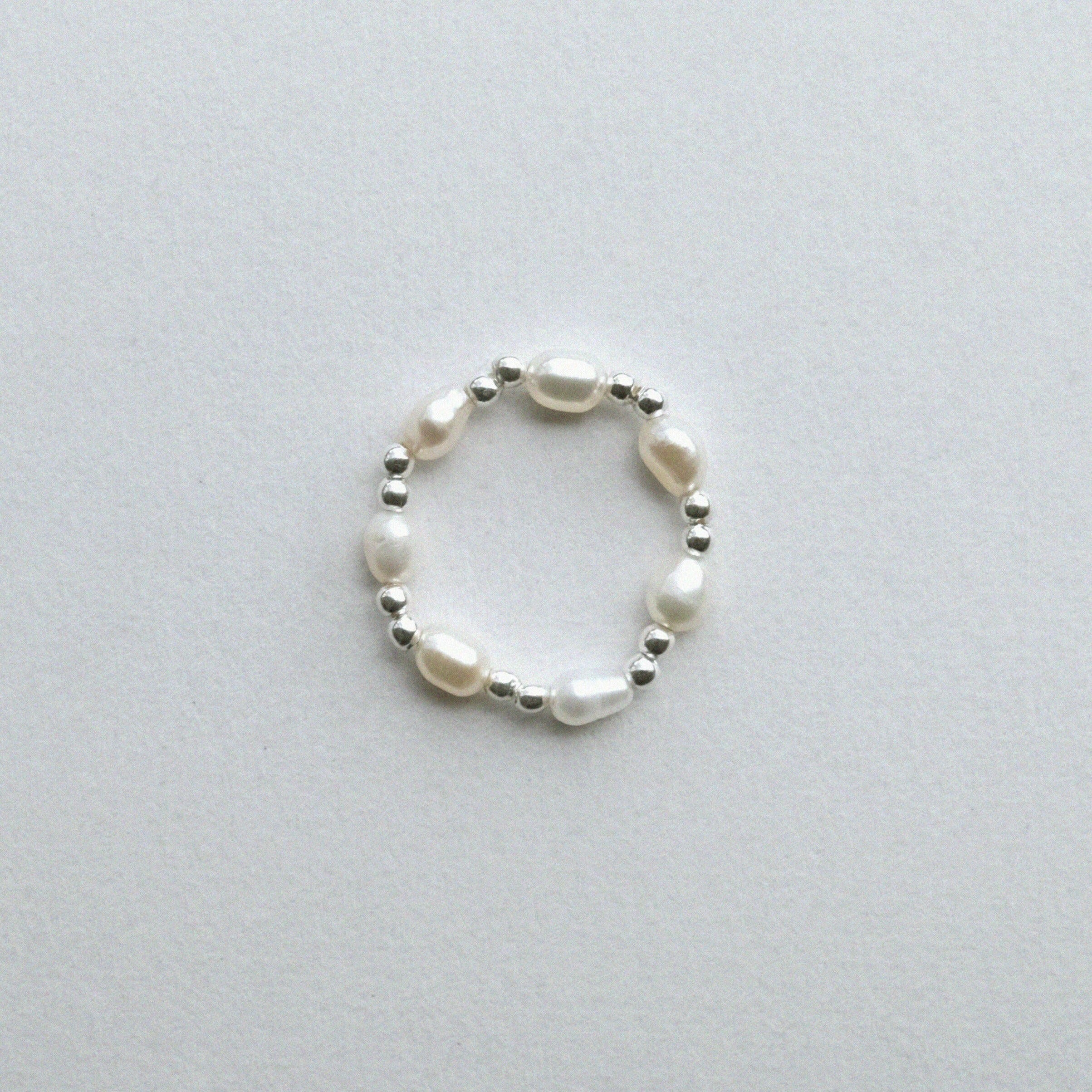 Evia Perla Ring featuring pearl style with sleek beads ball, and pearl alternating ring design