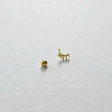 Screwball back and post detail on gold eyelash cartilage stud