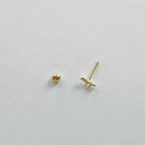 Aerial shot of screwball back and post detail on gold eyelash cartilage stud
