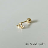 Side profile of 14K gold Freeline II cartilage earring with flowing abstract shape