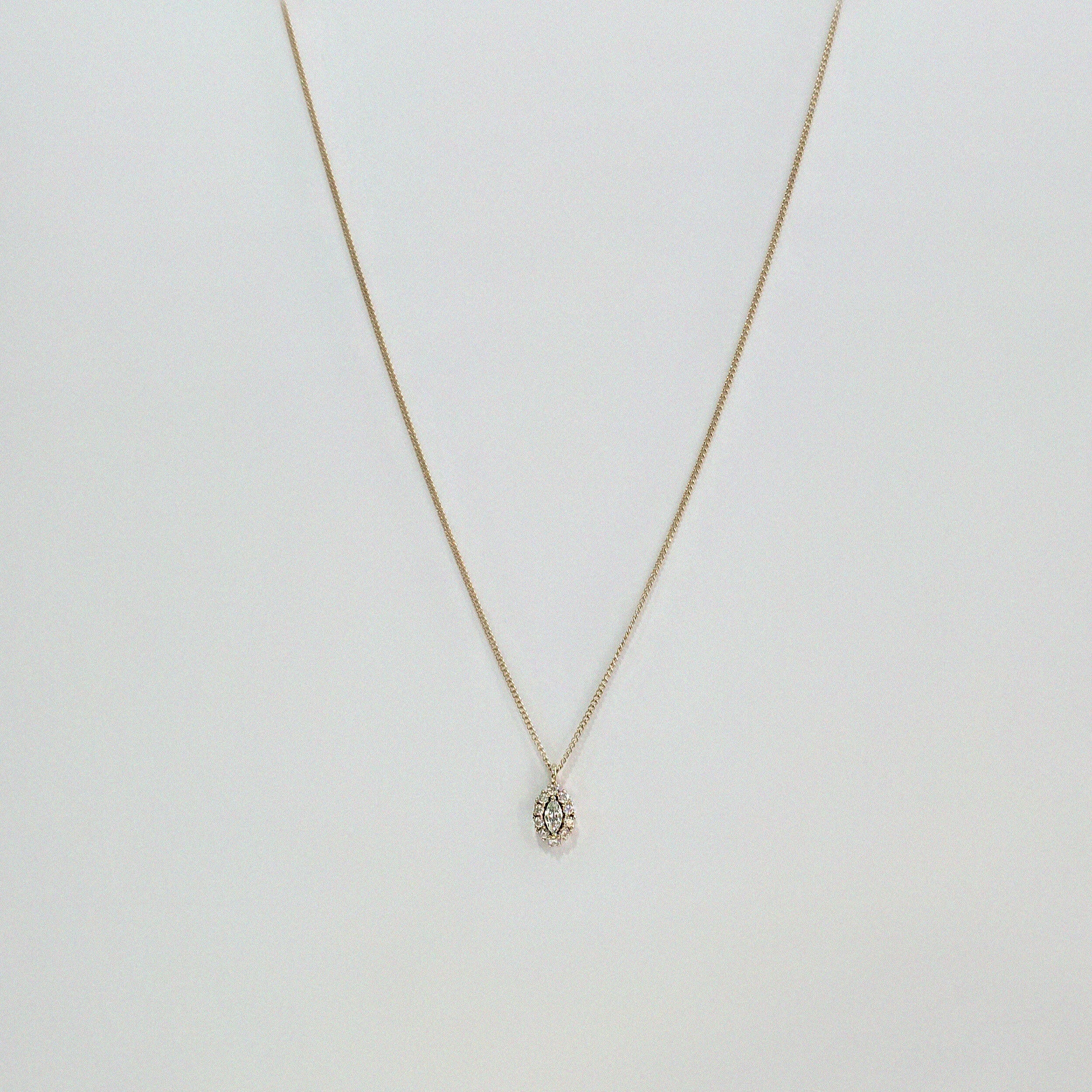 14K Solid Gold Gleam Necklace featuring marquise-cut CZ with halo setting on delicate gold chain
