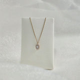 Gleam Crystal Necklace draped over a necklace stand for display