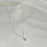 14K Solid Gold Gleam Necklace featuring marquise-cut CZ with halo setting on delicate gold chain