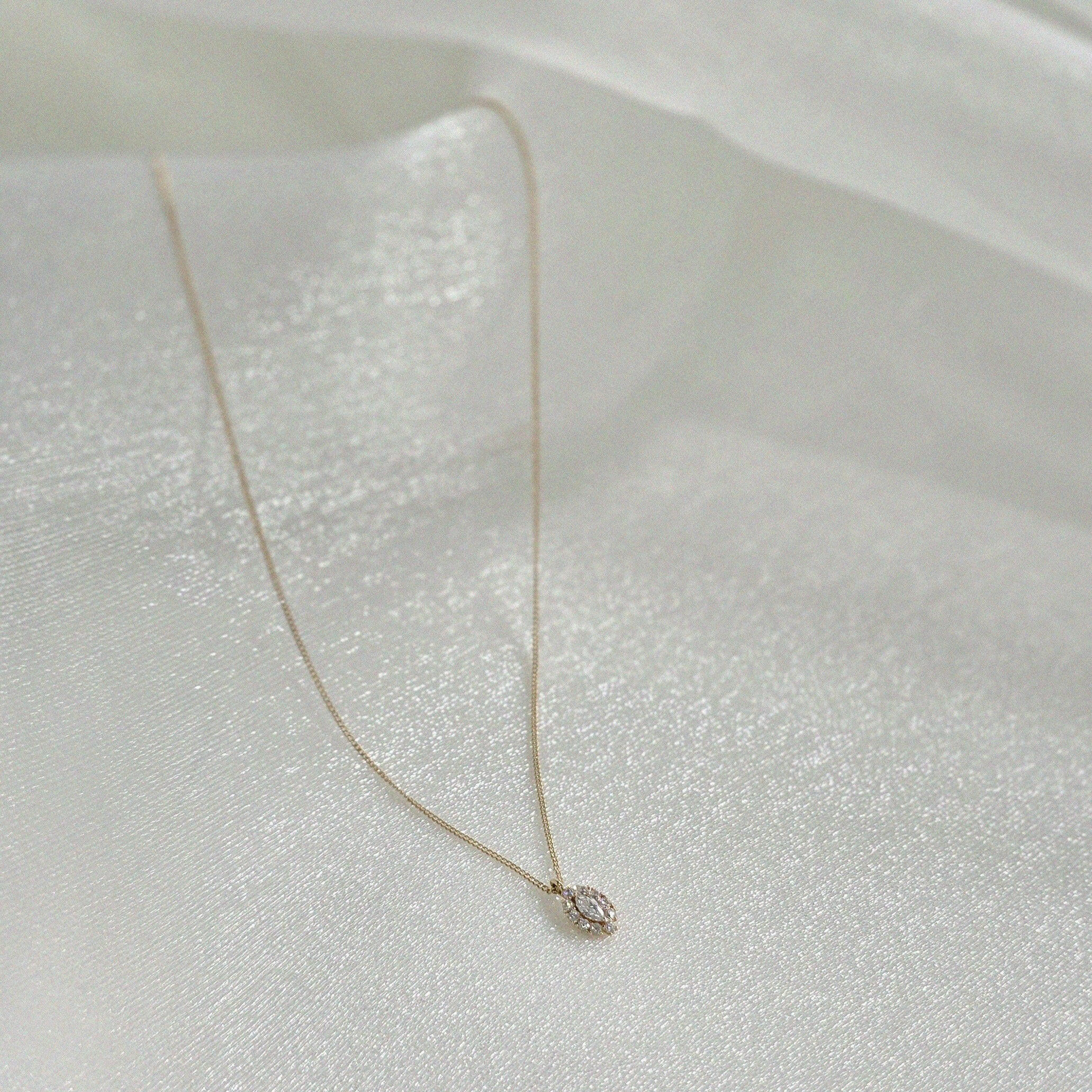 14K Solid Gold Gleam Necklace featuring marquise-cut CZ with halo setting on delicate gold chain