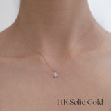 Model wearing Gleam Crystal Necklace with marquise halo pendant for refined everyday styling