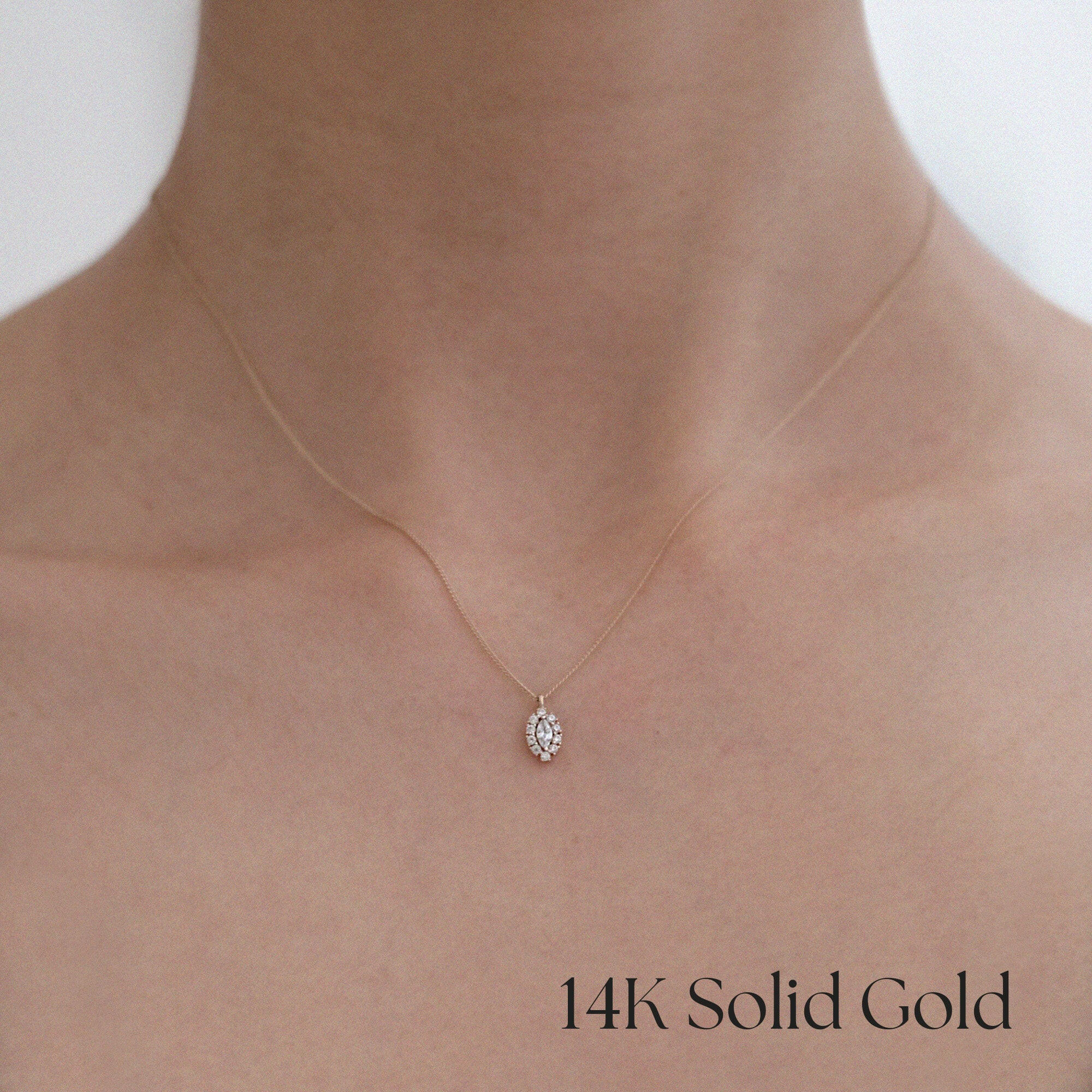Model wearing Gleam Crystal Necklace with marquise halo pendant for refined everyday styling