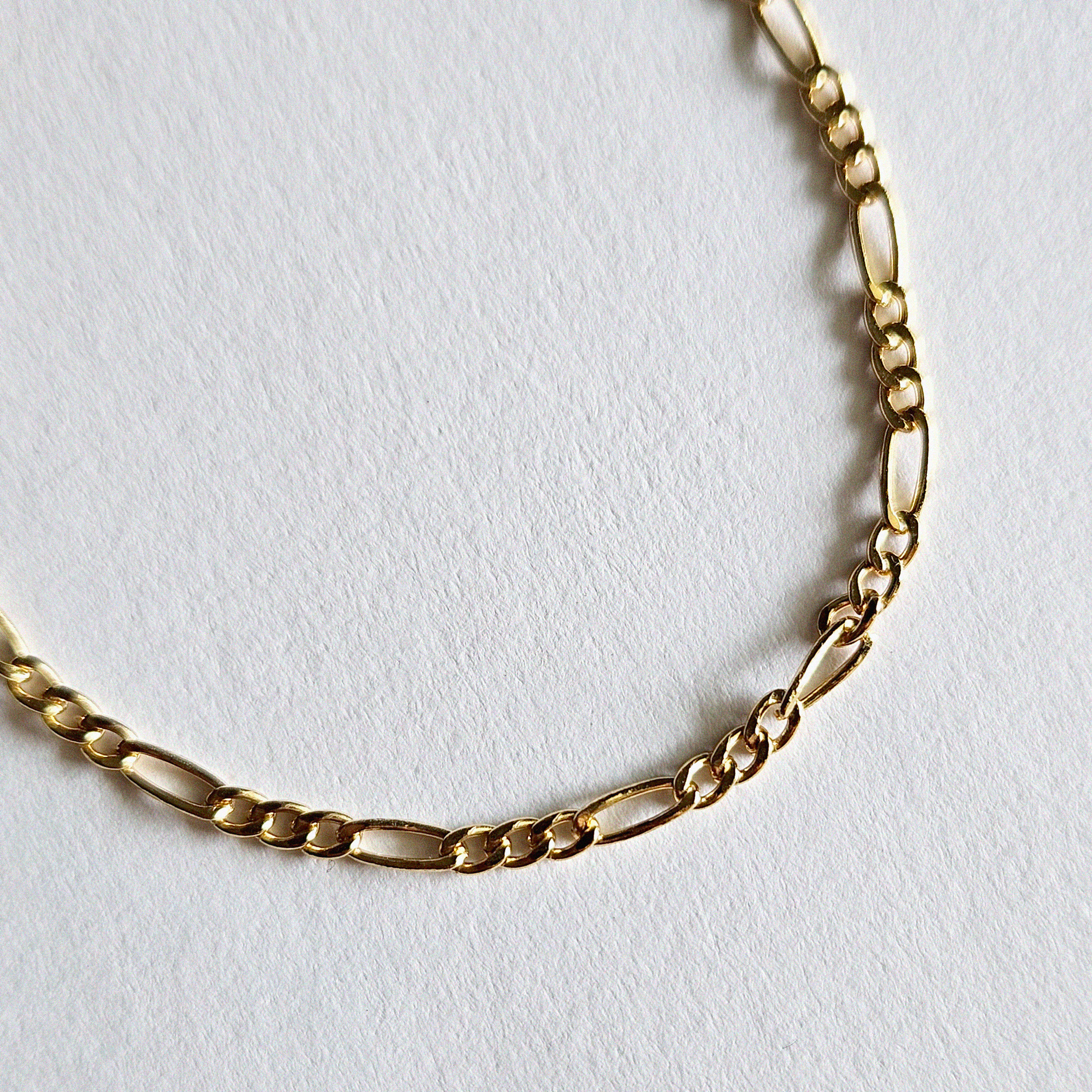 Fine craftsmanship of gold filled chain links viewed up close