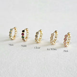 Five of Crystal Stone Huggies displayed in a row, each with a different colored stone