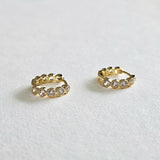 Side profile of Crystal Stone Huggies in clear colour showing stone setting and hoop thickness