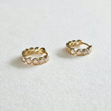Side profile of Crystal Stone Huggies in ice white colour showing stone setting and hoop thickness