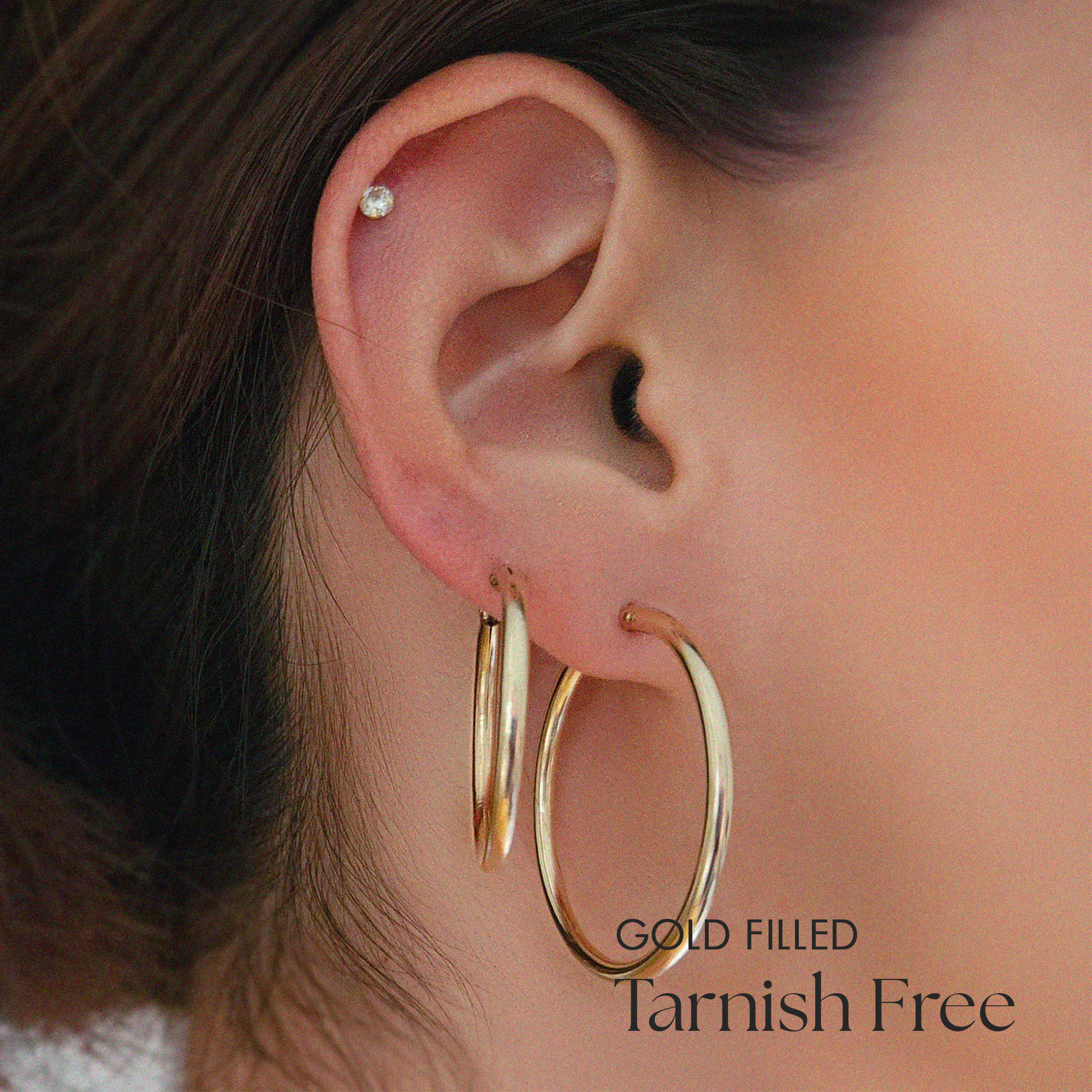 Model styling 27mm and 34mm hoops for a stacked ear look