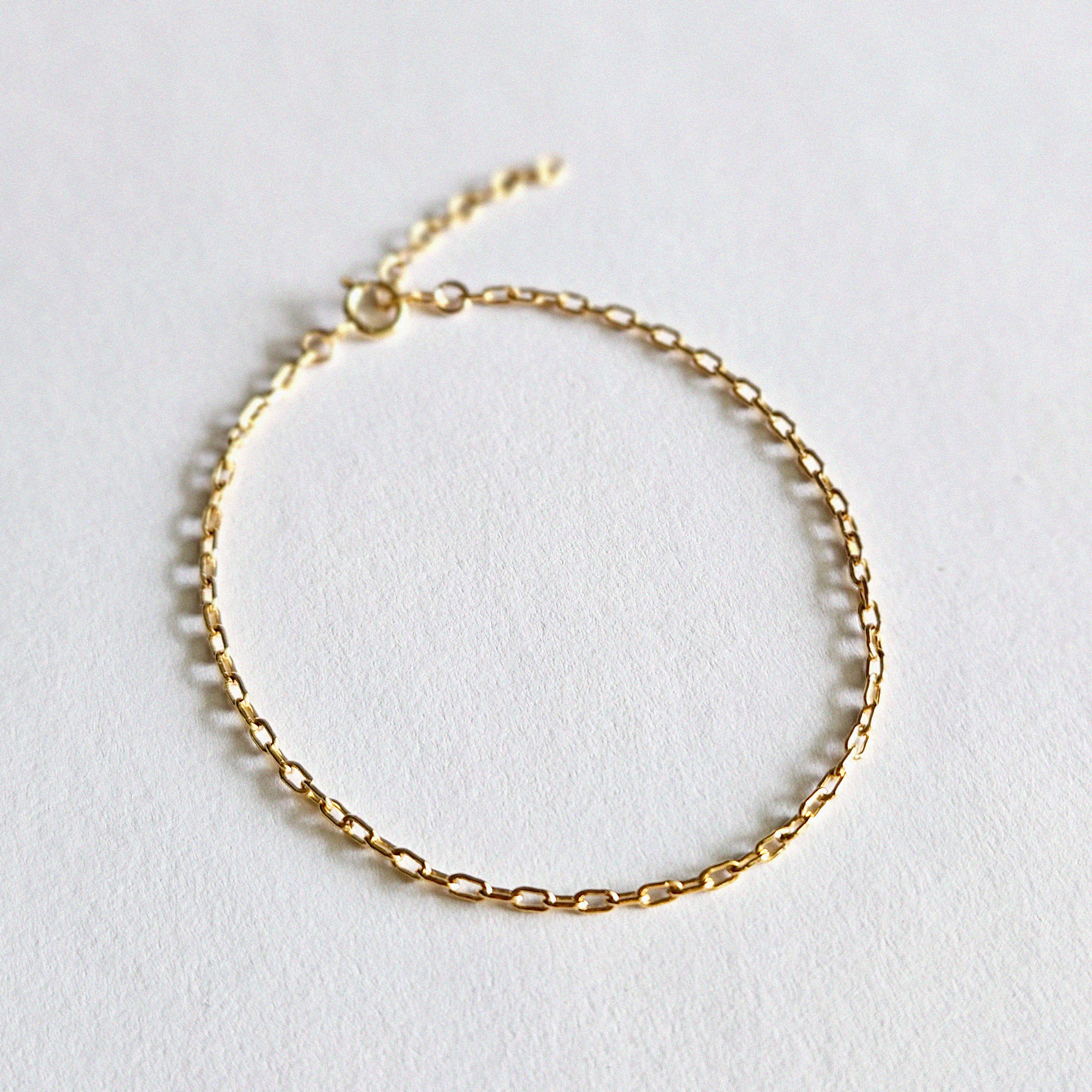 Simple chain bracelet displayed from top view, showing fine links and clasp