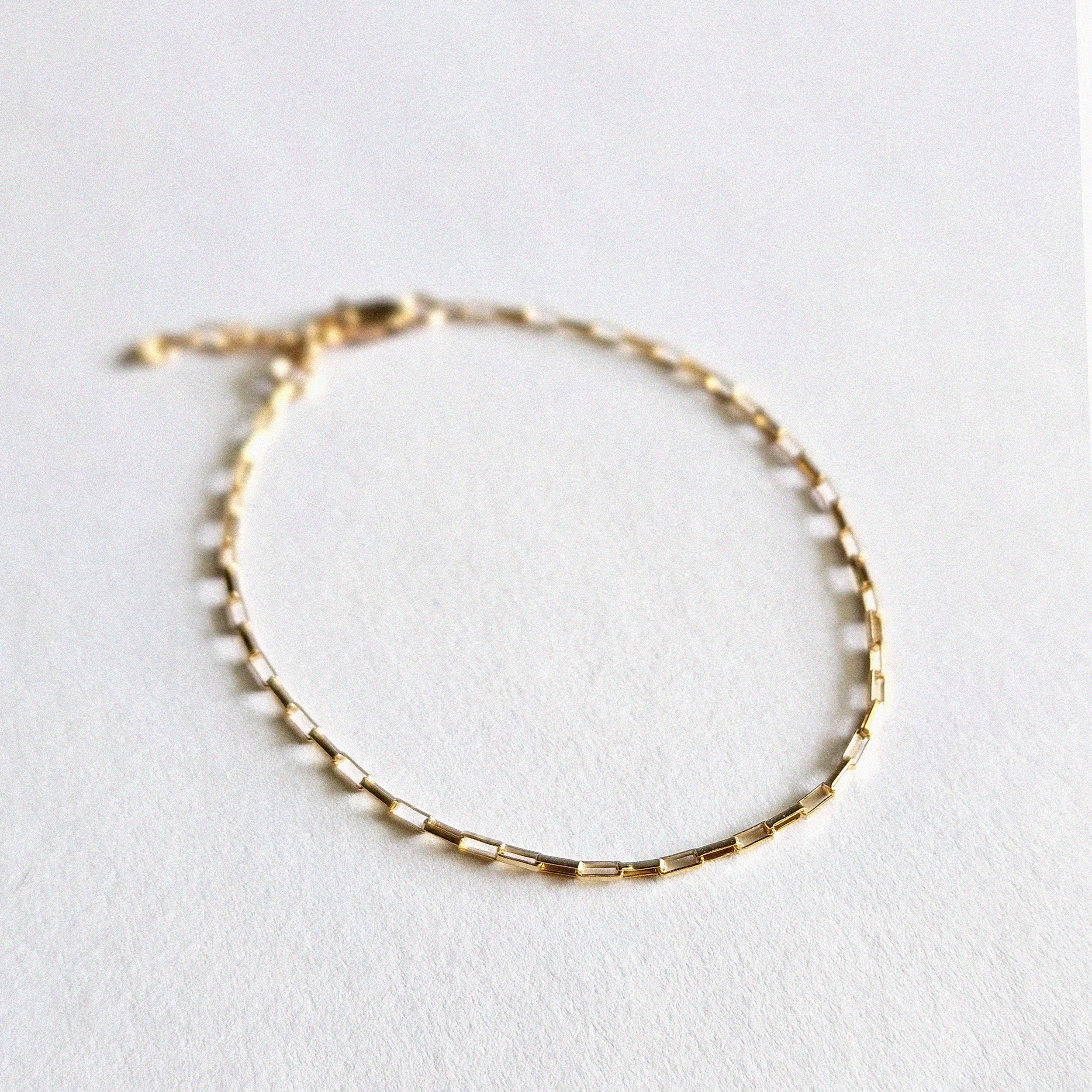 Zoom-in on gold chain texture highlighting dainty finish"