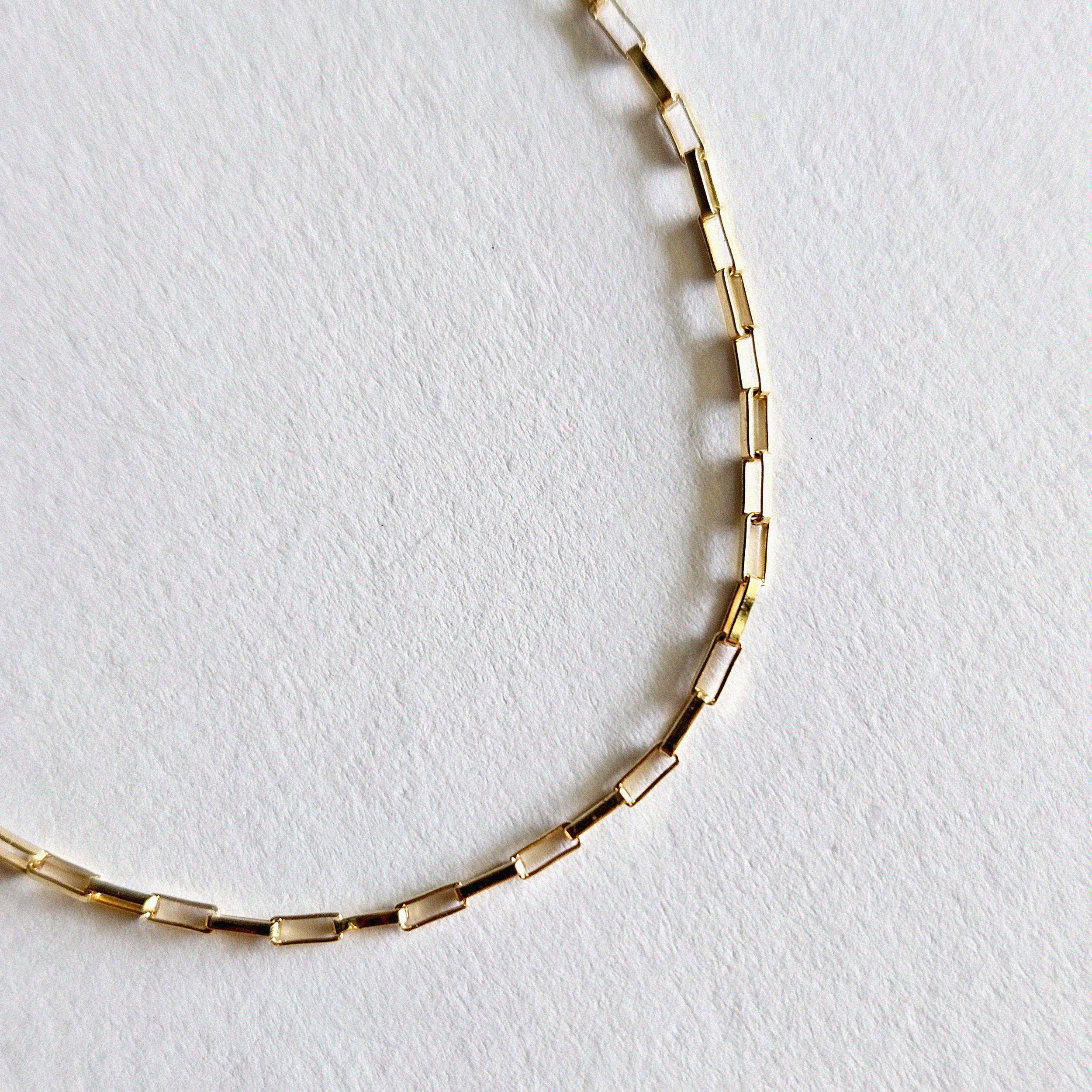 Macro view of fine gold links with smooth, light-catching cut