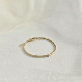 Minimalist gold bracelet with 3mm diamond styled flat with soft lighting