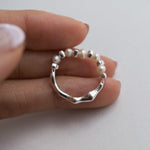 Handmade Sterling Silver beaded ring with freshwater pearl; reversible design with pearl on one side and grooved silver band on the other.