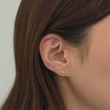 Close-up of earlobe wearing 14K Jade cartilage earring