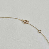 Spring clasp detail of the 14K La Cross Diamond Necklace showing secure fastening