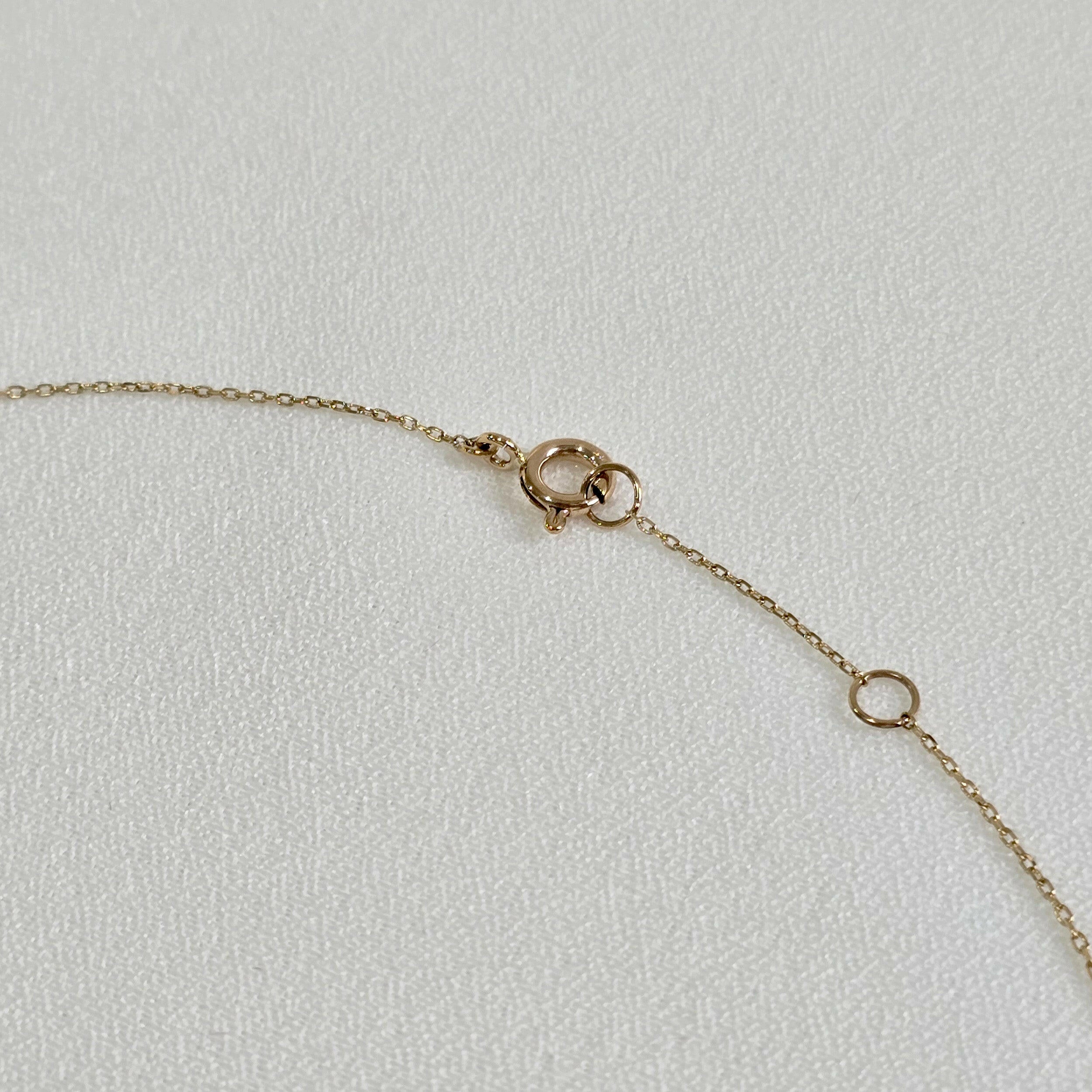 Spring clasp detail of the 14K La Cross Diamond Necklace showing secure fastening