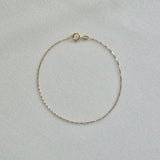 Minimalist 14K gold bracelet with shimmering box chain pattern