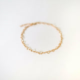 Aerial shot showing full heart-link chain structure and golden sheen