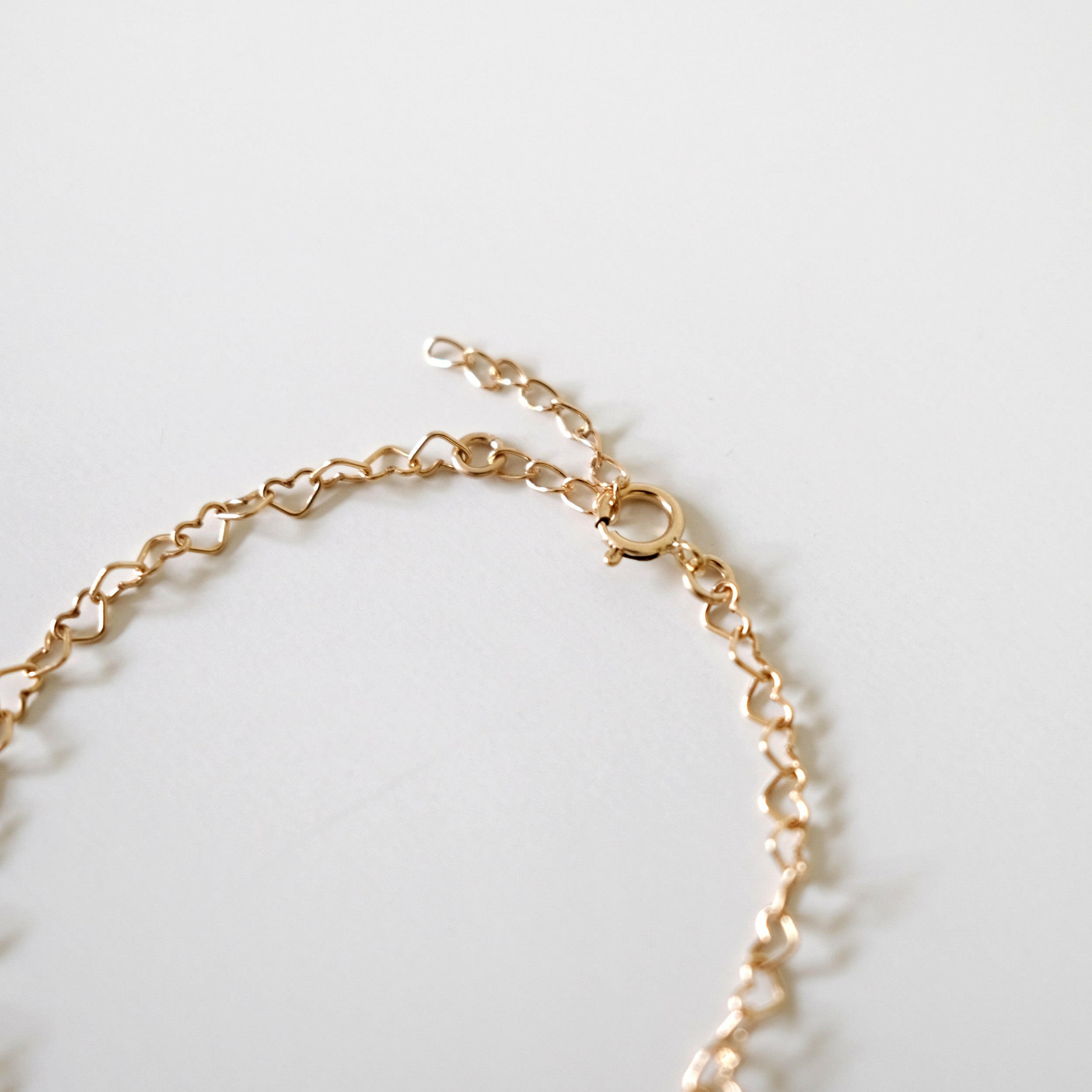 Detailed shot of bracelet clasp and extension chain showing adjustability