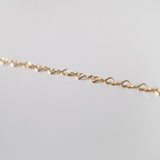 Zoomed-in view showing individual heart links in gold filled chain