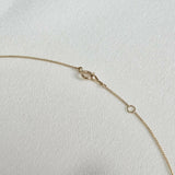 Close-up of 14K gold spring clasp with extender – secure and hypoallergenic design
