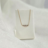 Side angle of diamond pendant showing depth and light reflection – handcrafted solid gold finish