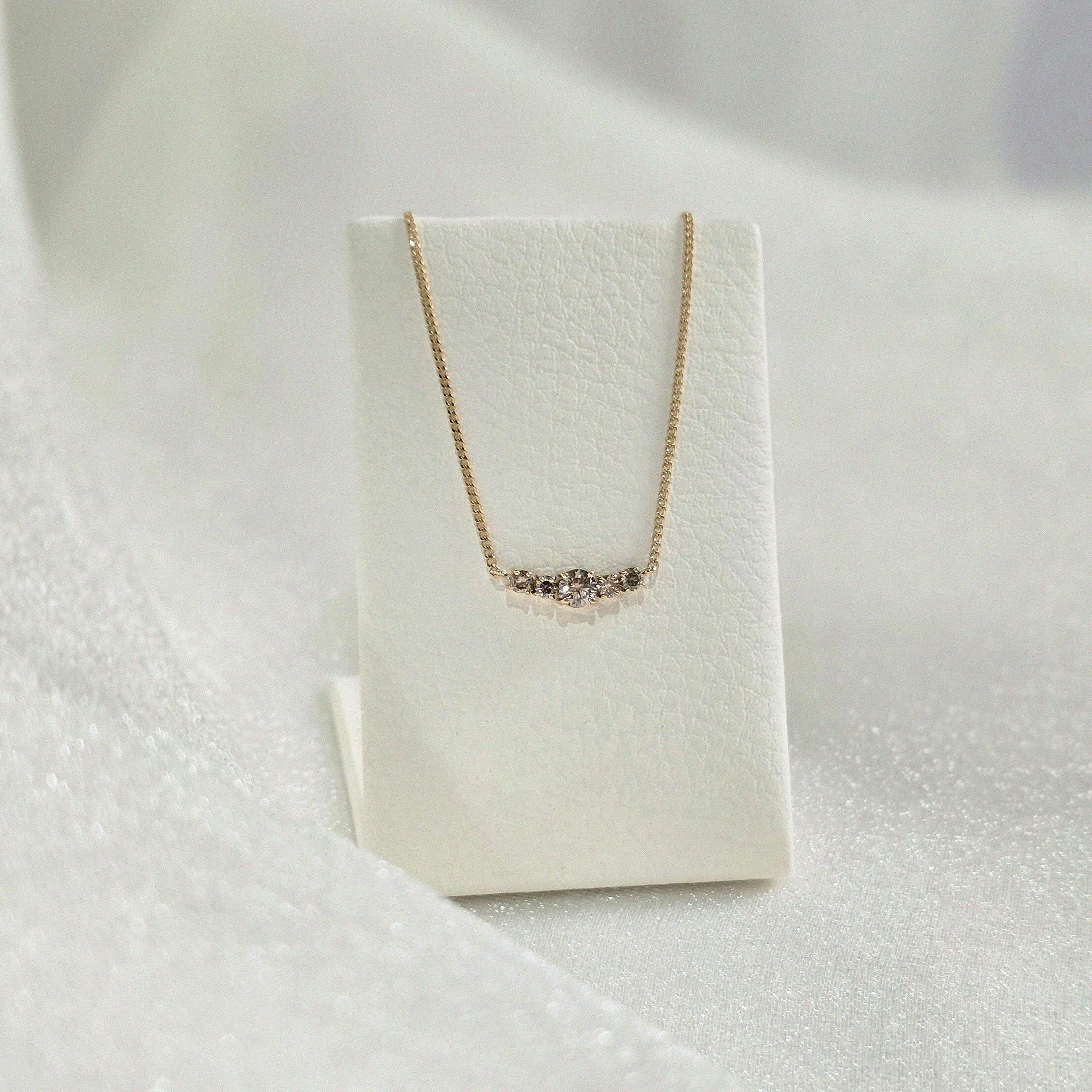 Side angle of diamond pendant showing depth and light reflection – handcrafted solid gold finish