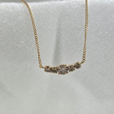 Extreme close-up of Luminex diamond pendant – 3.5mm x 12.5mm cluster set in polished 14K gold