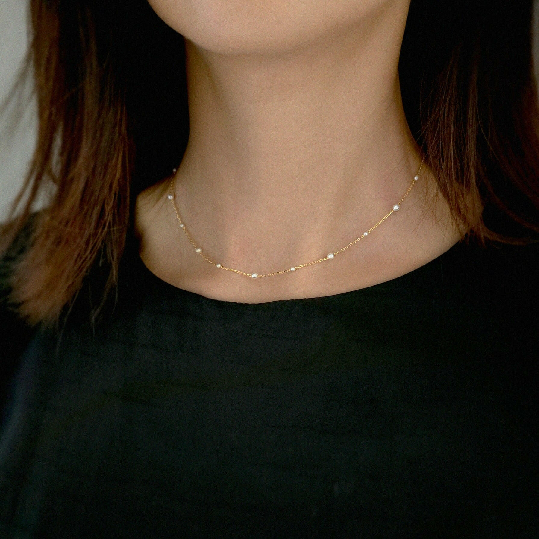 Model wearing mixed pearl necklace as a soft bridal accessory