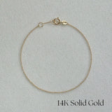 Ariel shot of 14K Paris Chain Bracelet displayed flat on a white background