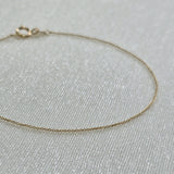 Macro detail of petite chain links with high-polish shine