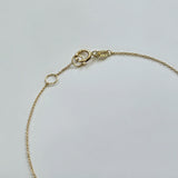 Close-up of Paris Bracelet’s fine link structure and polished 14K clasp
