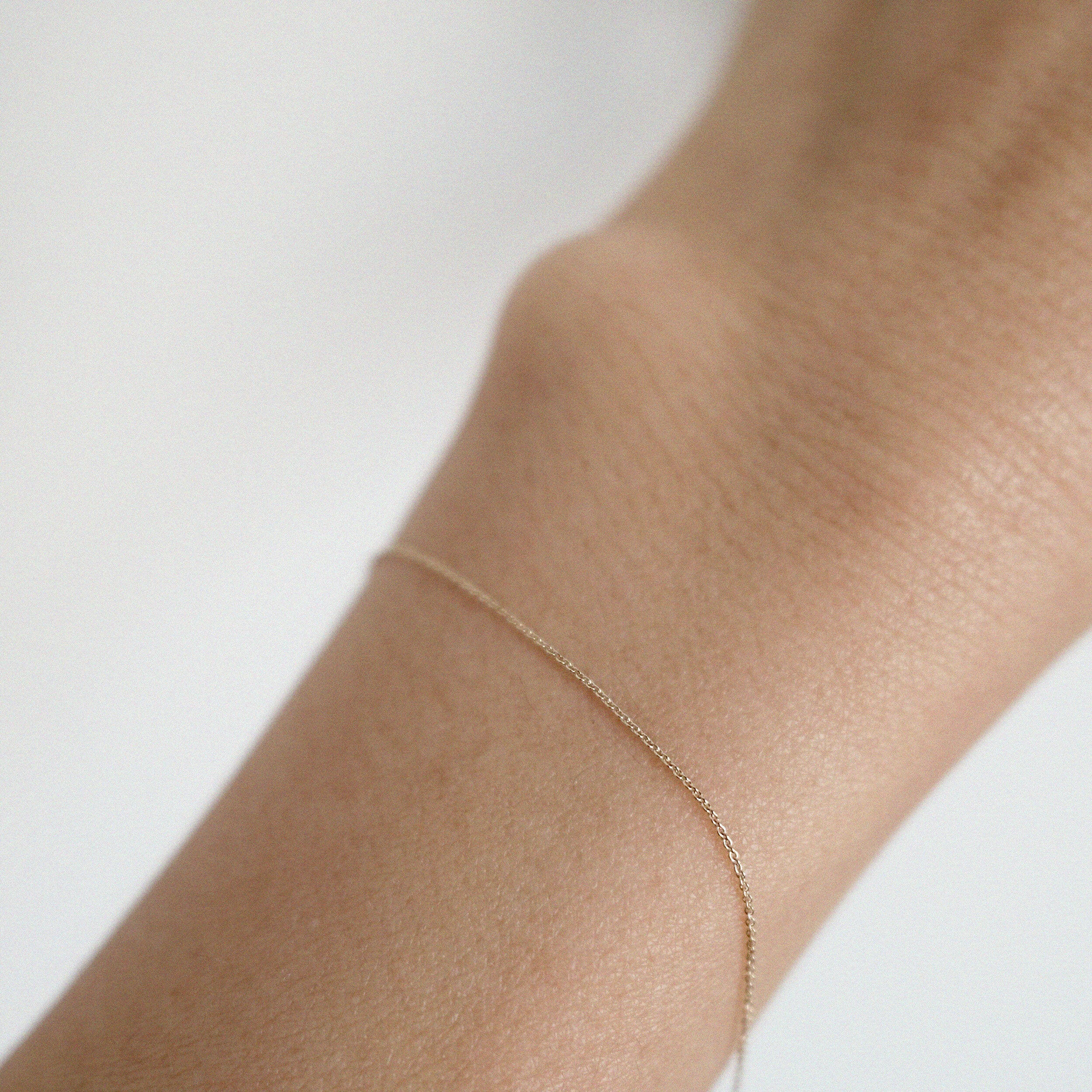 Model wearing the Paris Chain Bracelet solo for a subtle, elegant look