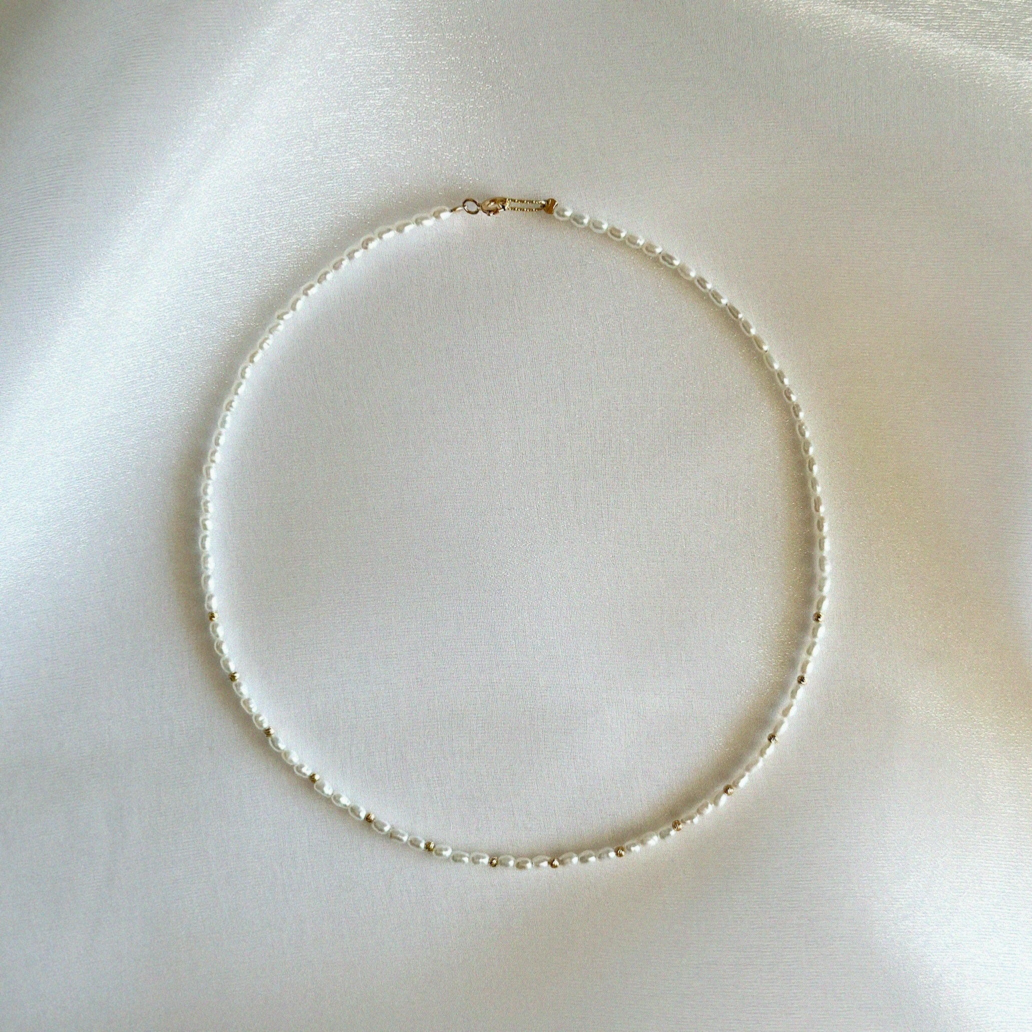Full chain extended flat to show length and spacing of beads