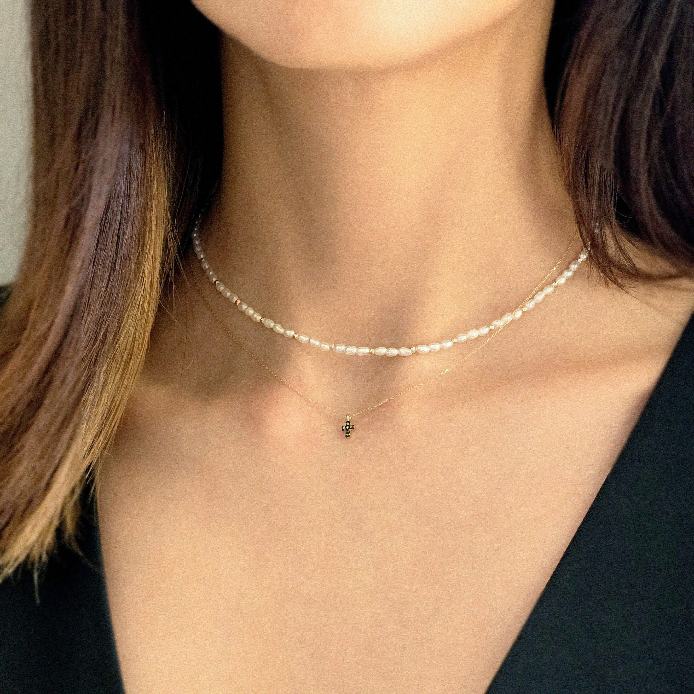 Detail view of 14K gold chain links and clasp on Petite Diamond Cross Necklace