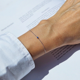 Petite crystal bracelet featuring a delicate stone and fine chain, perfect for elegant jewelry collections.
