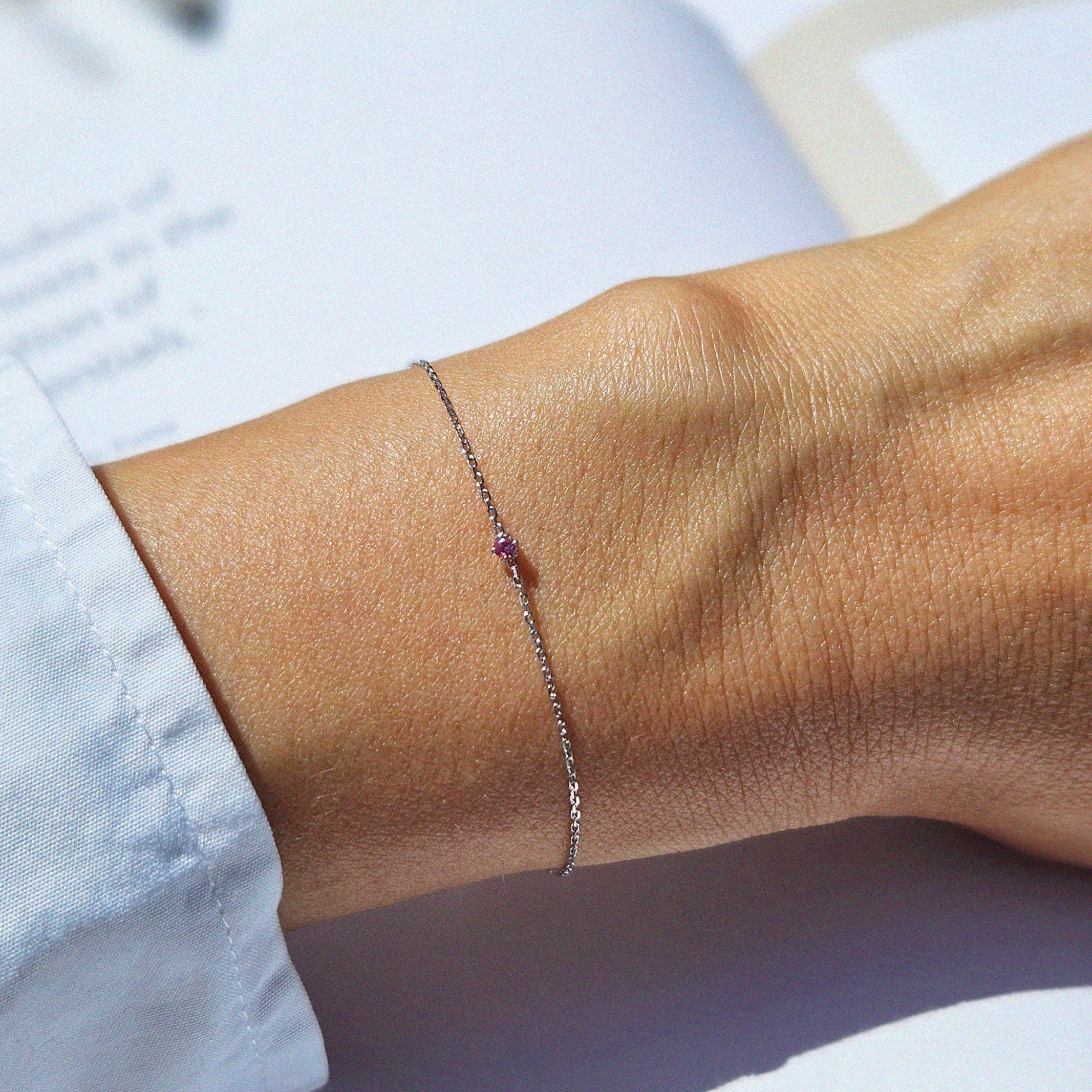 Petite crystal bracelet featuring a delicate stone and fine chain, perfect for elegant jewelry collections.