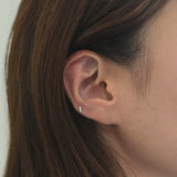 Petite CZ Bar Cartilage Earring shown on ear in close-up view