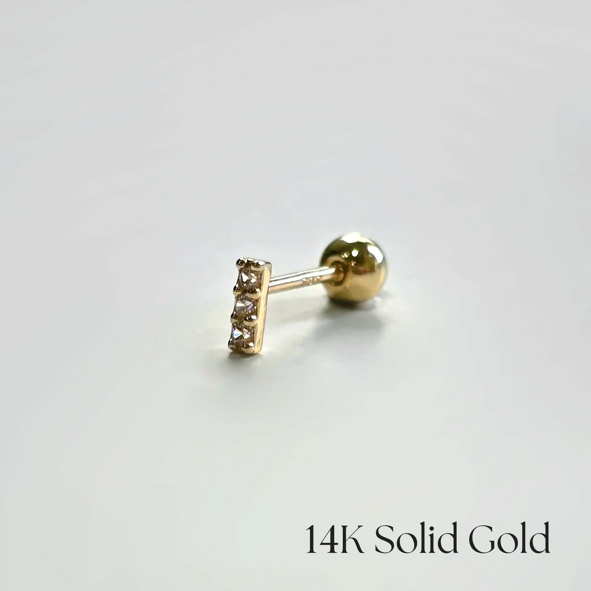 Side view of 14K Petite CZ Bar Earring on white background
