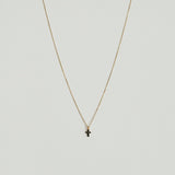 Close-up of 14K gold cross pendant with 4mm–7.5mm diamond in high-polish finish