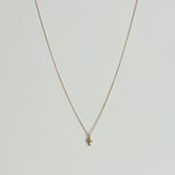 14K Petite Diamond Cross Necklace with clear stone, dainty cross pendant photographed