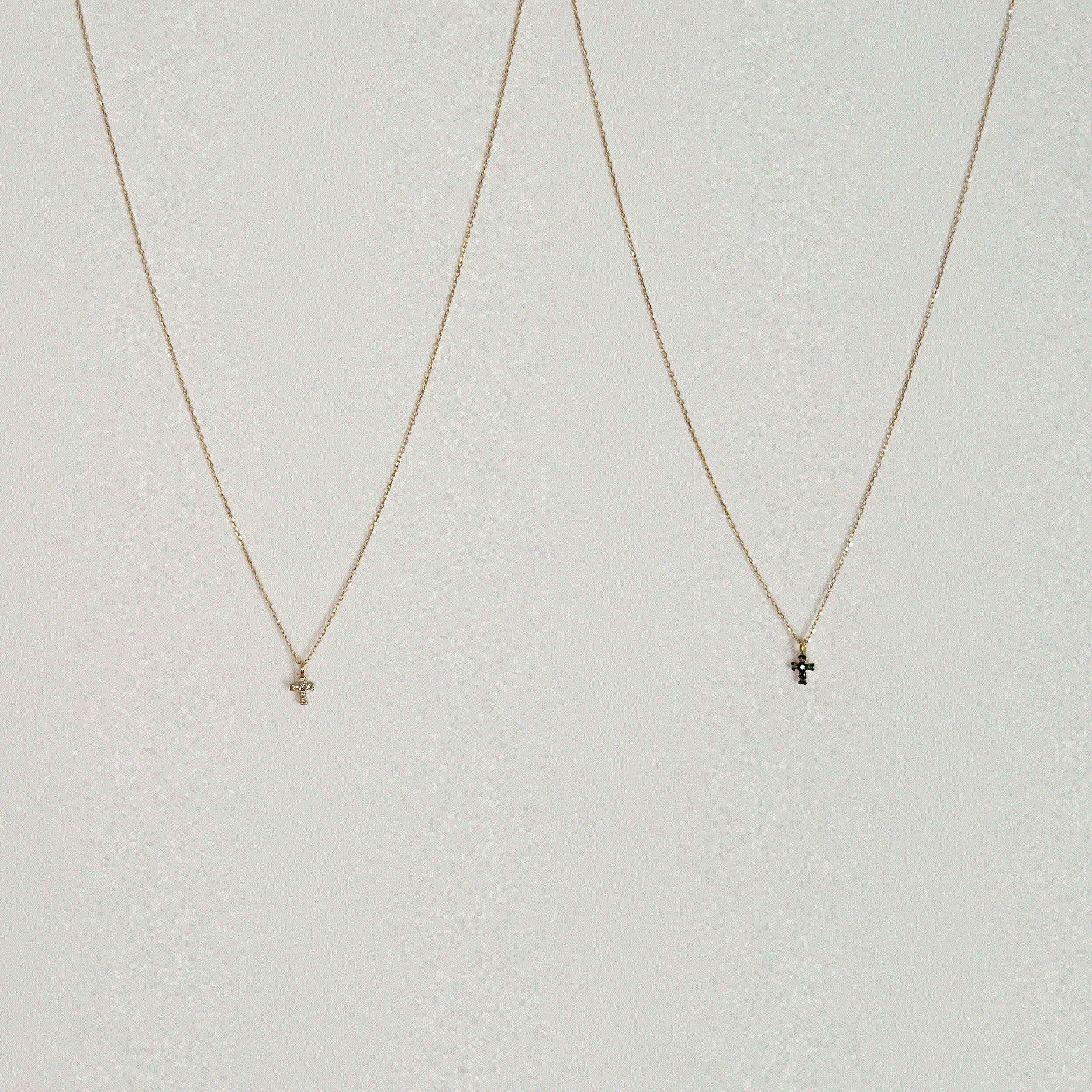 14K Petite Diamond Cross Necklace with clear or green stone, dainty cross pendant photographed